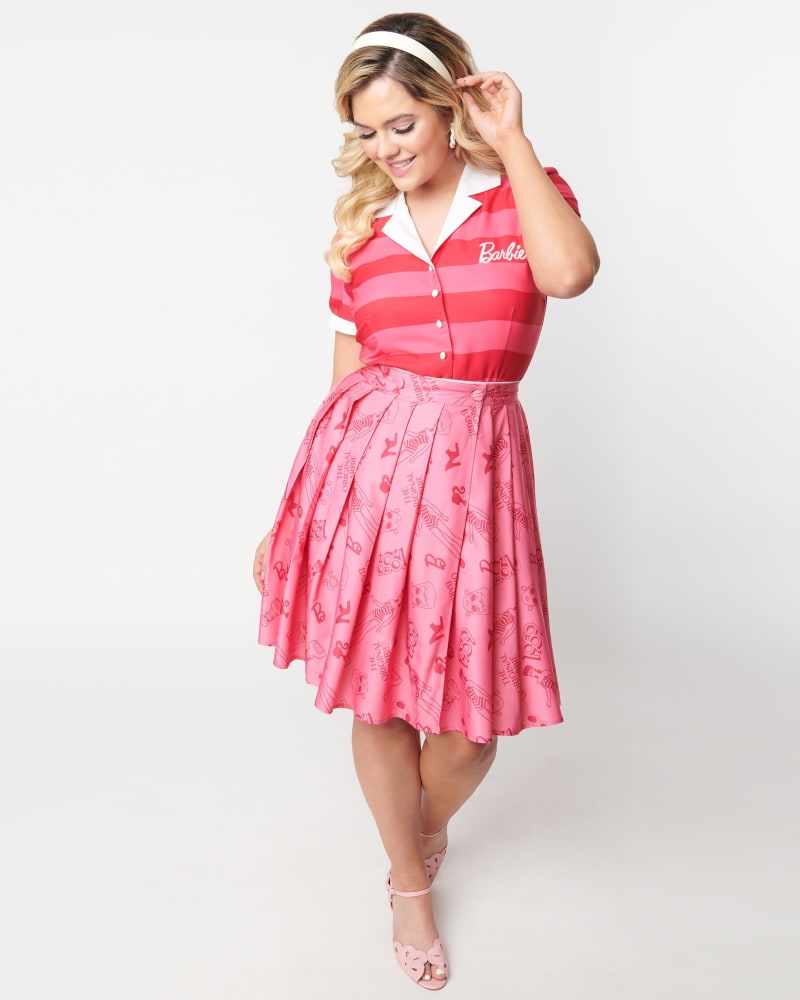 Front of a model wearing a size 4X Barbie x Unique Vintage Pink Barbie Icon Collins Wrap Swing Skirt in Pink by Unique Vintage. | dia_product_style_image_id:301128